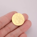 Detailed view of a gold-plated stainless steel round pendant with a wolf head and paw engraving - Pendant / Gold