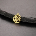 Detailed close-up of golden moon and lotus pendant on a grey textured slate background - Moon Lotus - Gold (Style 2 - Gold)