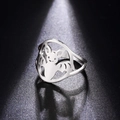 Detailed view of silver hollow bat ring with minimalist cut-out design on black background - US 7 / Steel