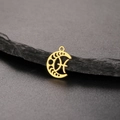 Macro detail of an 18K gold plated stainless steel crescent moon phase pendant - Gold-Pisces