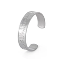 Close-up of vintage Viking runes engraved on brushed stainless steel open cuff bracelet - Silver Brushed Runes (Style 7)