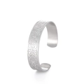 Macro shot of silver Celtic knot and triquetra carvings on vintage steel cuff bracelet - Silver Celtic Triskelion (Style 14)