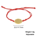 Macro detail of red woven bracelet with adjustable knot and golden flower of life charm - Flower of Life Style-Gold Color