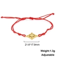 Detail of red cord bracelet with a gold-plated geometric charm and adjustable knot - Celtic Knot Style-Gold Color