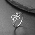 Detailed macro view of a floral silver steel ring with a sparkling center zircon stone - US 7 / Steel