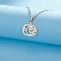 Detailed view of hollow pumpkin pendant with moon and bat motifs in silver stainless steel - Necklace / Steel