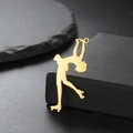 Detail of 18K gold plated roller skater pendant on elegant black stone background - Arabesque Pose (Style 4-Gold)