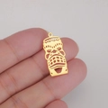 Close-up of a 18K gold plated titanium steel hollow clown mask pendant held in hand - Style 2 Gold