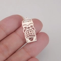 Tribal hollow mask pendant in silver finish held by hand to show size and craftsmanship - Style 2 Silver