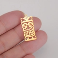 Macro shot of gold hollow joker mask pendant held in hand to show size and detail - Style 4-Gold