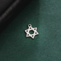 Polished silver stainless steel hexagram pendant for DIY necklaces on a dark green surface - Hexagram Star (Silver)