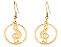 Detail of golden treble clef hoop earrings featuring elegant musical note design charms - Gold Round Music Symbol