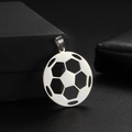 Detail shot of a hollowed-out soccer ball pendant on a textured black gift box - Style A / Steel