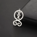 Macro view of silver stainless steel Troll Cross pendant with hollow Nordic runes - Steel