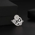 Close-up of silver hollow daisy pendant connector for DIY jewelry making - Steel