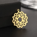 Macro shot of gold stainless steel mandala flower pendant on black jewelry box - Gold