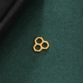 Macro shot of three connected gold hexagonal honeycomb charms on a dark green felt background - Honeycomb Shape - Gold