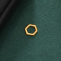 Macro detail of a polished gold-plated hollow hexagonal pendant on a textured dark background - Style 8-Gold Color