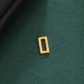 Macro view of a 18K gold plated hollow rectangular geometric pendant on black leather - Style 7-Gold