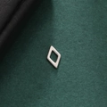 Macro view of minimalist silver rhombus earring on premium textured dark green background - Style 6-Steel Color