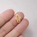 Minimalist gold hollow cactus charm pendant for DIY jewelry on a fingertip - Cactus Hollow - Gold