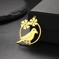 Golden stainless steel parrot and flower hollow pendant displayed on a black jewelry box - Gold