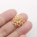 Hollow gold lotus pendant in stainless steel held to show size and intricate petals - Lotus Shape - Gold