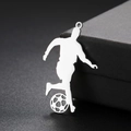 Macro detail of polished silver soccer player pendant with cutout football design - Steel