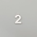 Detailed close-up of polished stainless steel number 2 pendant for DIY jewelry making - Number 2