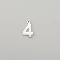 Close-up of polished stainless steel number 4 charm pendant for DIY jewelry and necklaces - Number 4