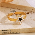 Adjustable golden stainless steel star ring with black and white enamel star accents - Star Ring