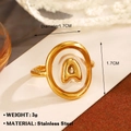 Puffy golden stainless steel ring featuring letter A in a clear oval display - Letter A