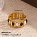 Golden stainless steel wave ring with black and white oval enamel inlay details - Wavy Black White Enamel Style (1456)