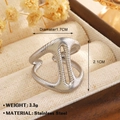 Minimalist silver stainless steel ring with textured hollow lines in a jewelry box - Spiral Texture (1573) / Steel