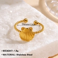 Golden starfish shell open ring with braided stainless steel band on white stone - Braided Shell Style (1266) / Adjustable Open / Gold
