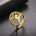 Golden stainless steel ring with a hollow gymnast silhouette in a 45-degree angle view - US 6 / Gold