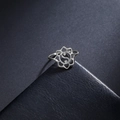 Silver hollow lotus Tai Chi stainless steel ring for women on dark textured background - US 7 / Steel