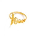 Detail showing intricate wing and vine patterns on a polished gold stainless steel ring - US 7 / Gold
