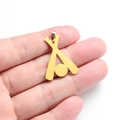 Polished gold stainless steel necklace pendant featuring crossed baseball bats and ball - Gold