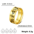 Detail view of 8mm wide stainless steel ring with black animal engraving patterns - US 7 / Gold