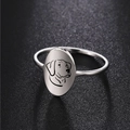 Polished stainless steel ring featuring minimalist laser-etched dog portrait on oval face - US 7 / Steel