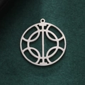 Minimalist silver geometric circular cutout pendant on dark green textured background - Steel