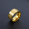 Macro view of 10mm wide gold stainless steel ring with Celtic knot braided pattern - US 7 / Gold