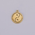 Macro view of golden stainless steel Tai Chi Yin Yang pendant with cut-out detail - Gold