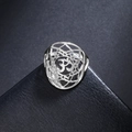 Detail of silver stainless steel Om lotus ring with intricate mandala cut-out patterns - US 7 / Steel