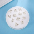Ensemble de 12 pendentifs constellations du zodiaque en acier poli sur plateau rond - Acier