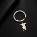 Polished silver stainless steel keychain featuring a cute cartoon girl silhouette charm - High Ponytail Girl / Silver