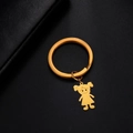 Polished gold stainless steel keychain featuring a cartoon girl pendant on dark background - High Ponytail Girl / Gold
