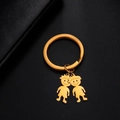 Polished gold stainless steel keychain featuring two cute cartoon boy charms on leather - Messy Hair Boys / Gold