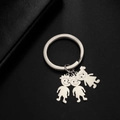 Minimalist stainless steel keychain with three cartoon boy and girl family figure charms - Boys And Girl / Silver